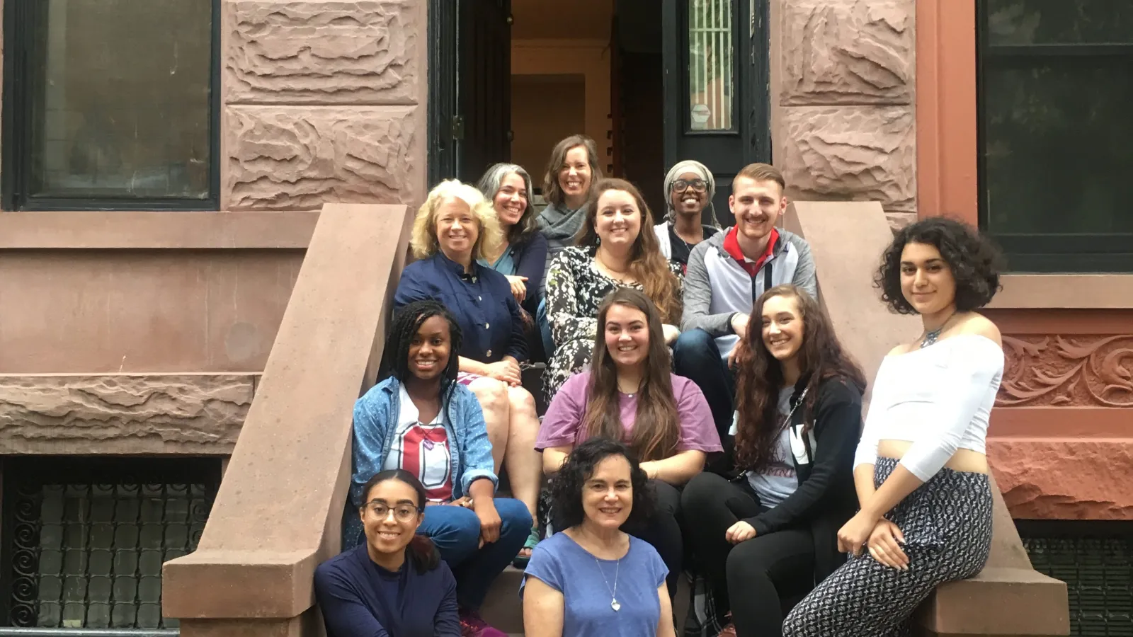 OSU faculty and students sitting on building steps in New York City.