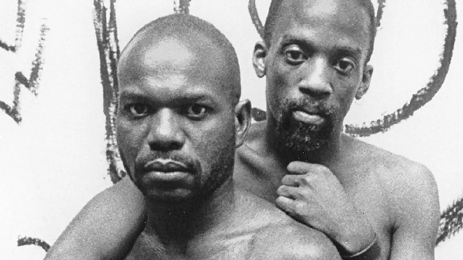 Tongues Untied Cover (two men embracing and staring at the camera)