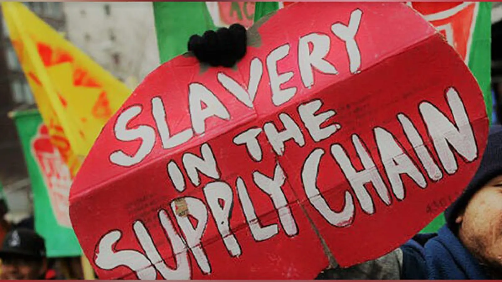 Tomato-shaped sign that reads "Slavery in the supply chain"