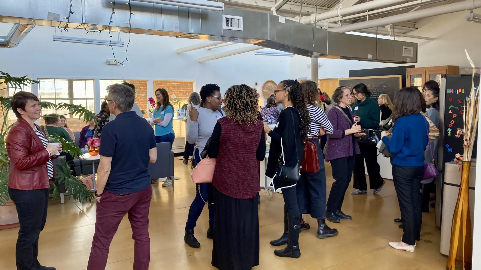 Faculty members associated with the FREE Center mingle and network at the first ever FREE Center event.