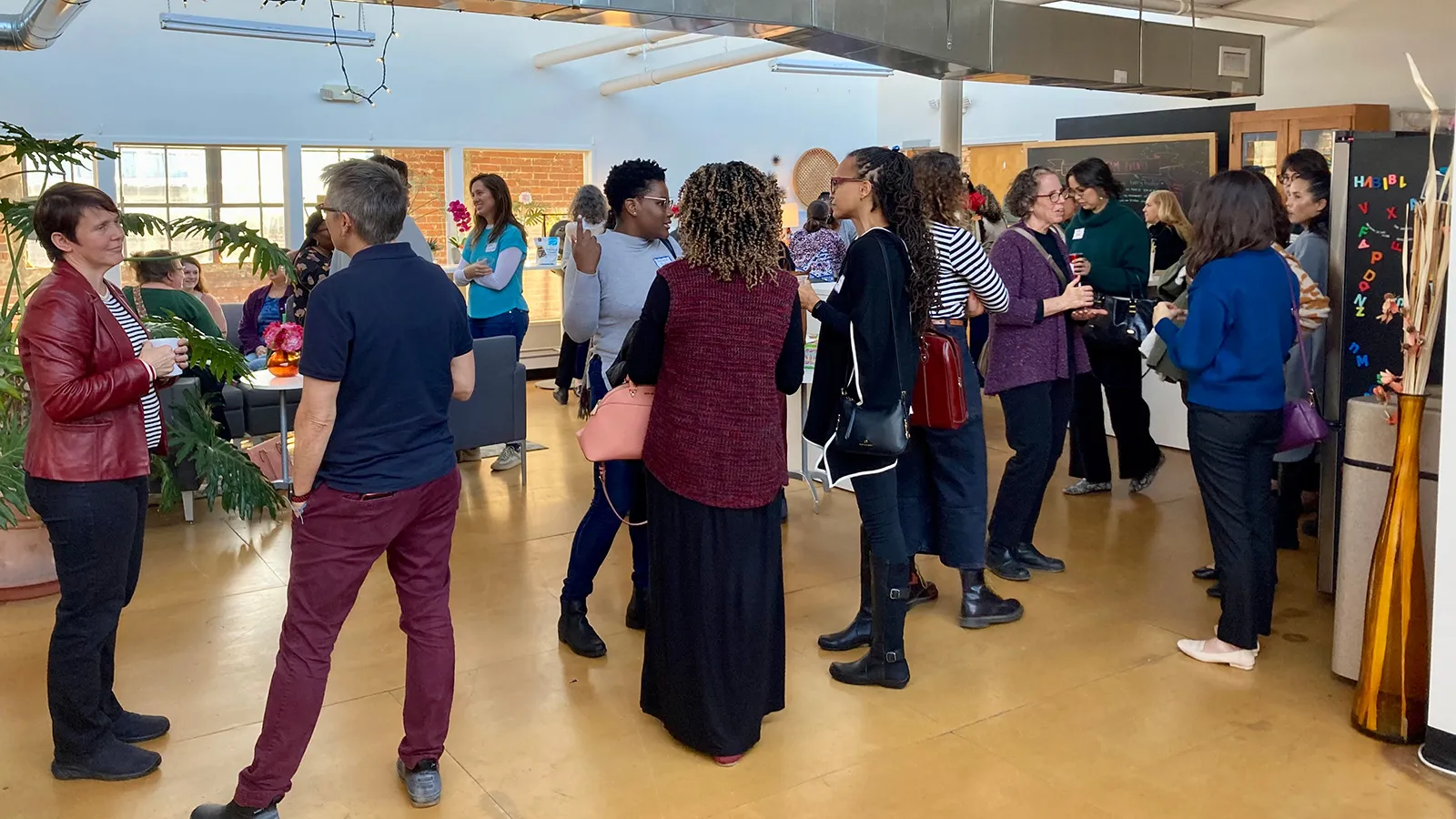 People talking and mingling at event