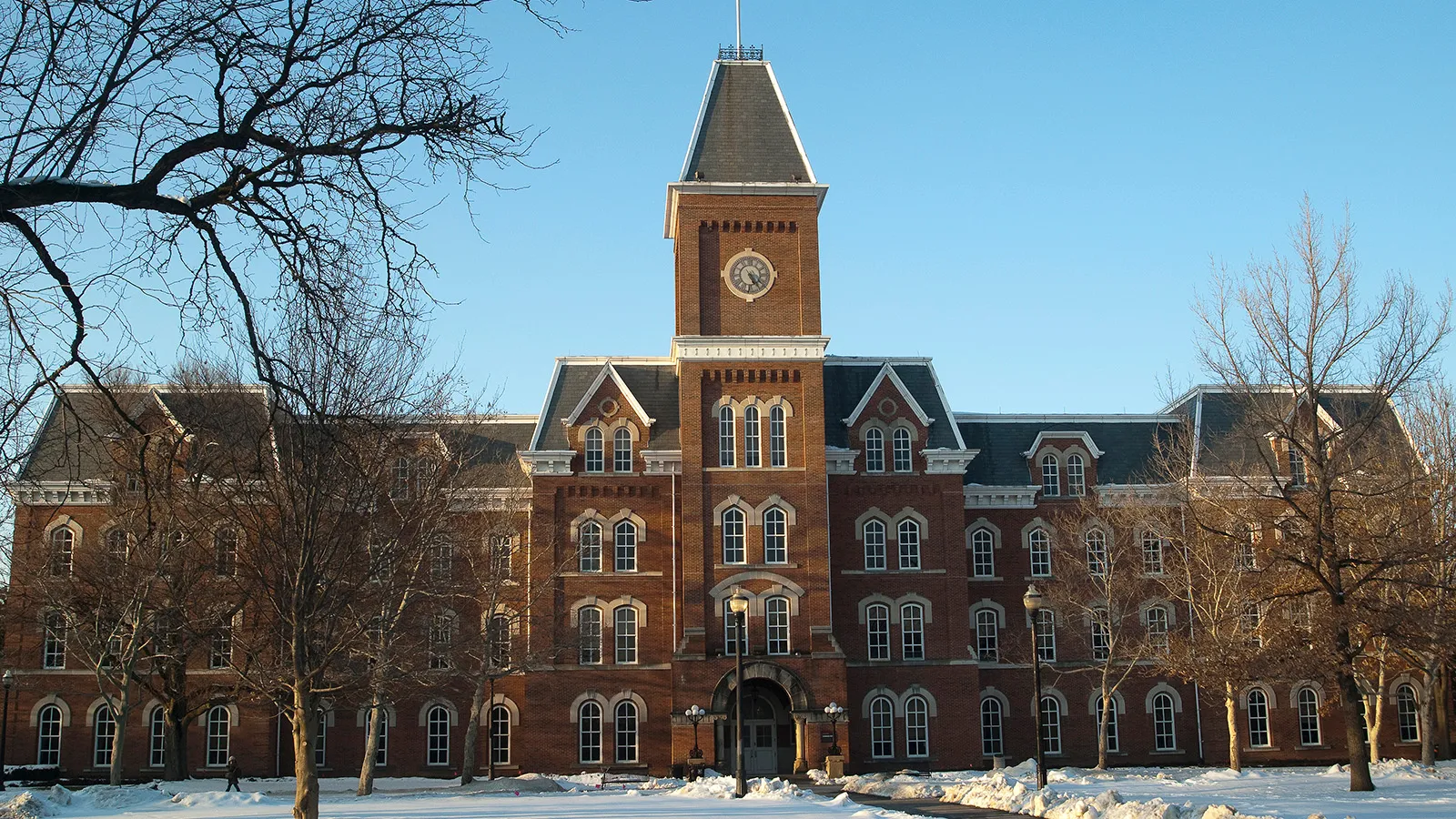 University Hall with blue skies and snow on the ground