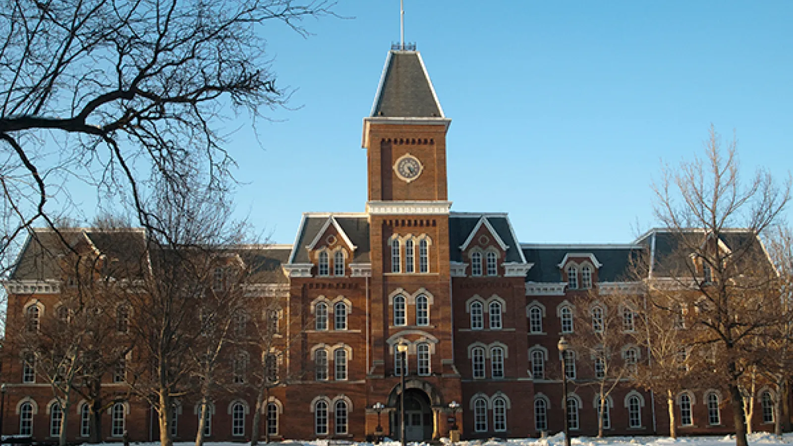 University Hall with blue skies and snow on the ground
