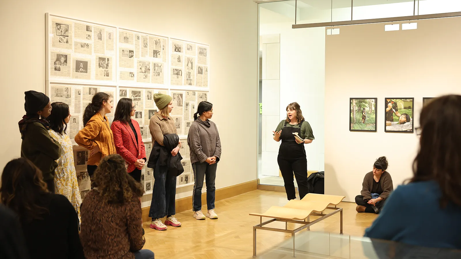 Librarian leading discussion at art exhibit