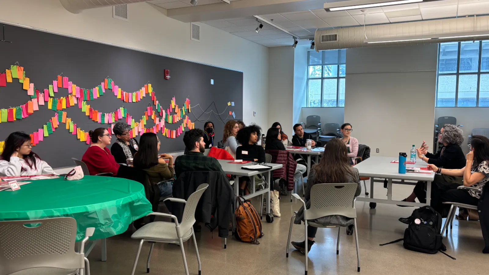 students sitting at tables listening to workshop