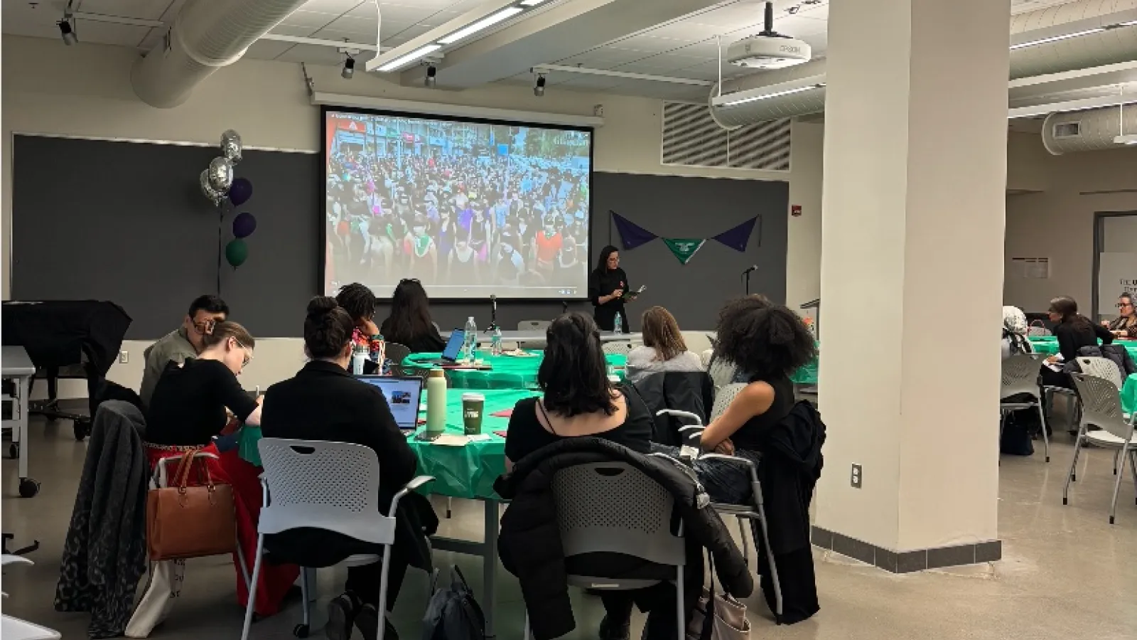 students listening to lecture by Claudia Cabello Hutt