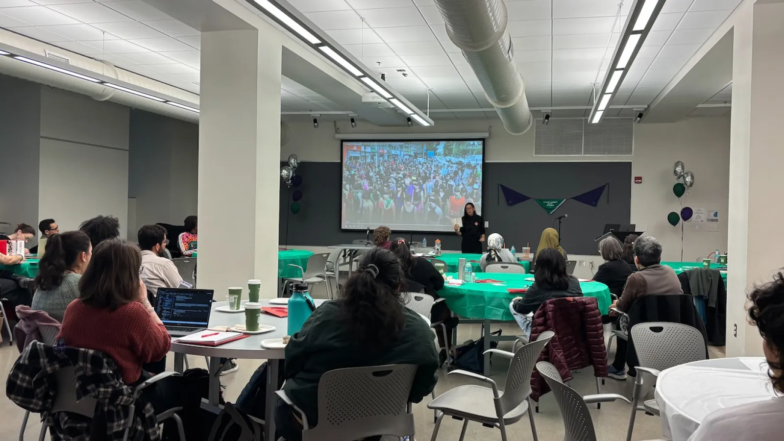 students listening to lecture by Claudia Cabello Hutt