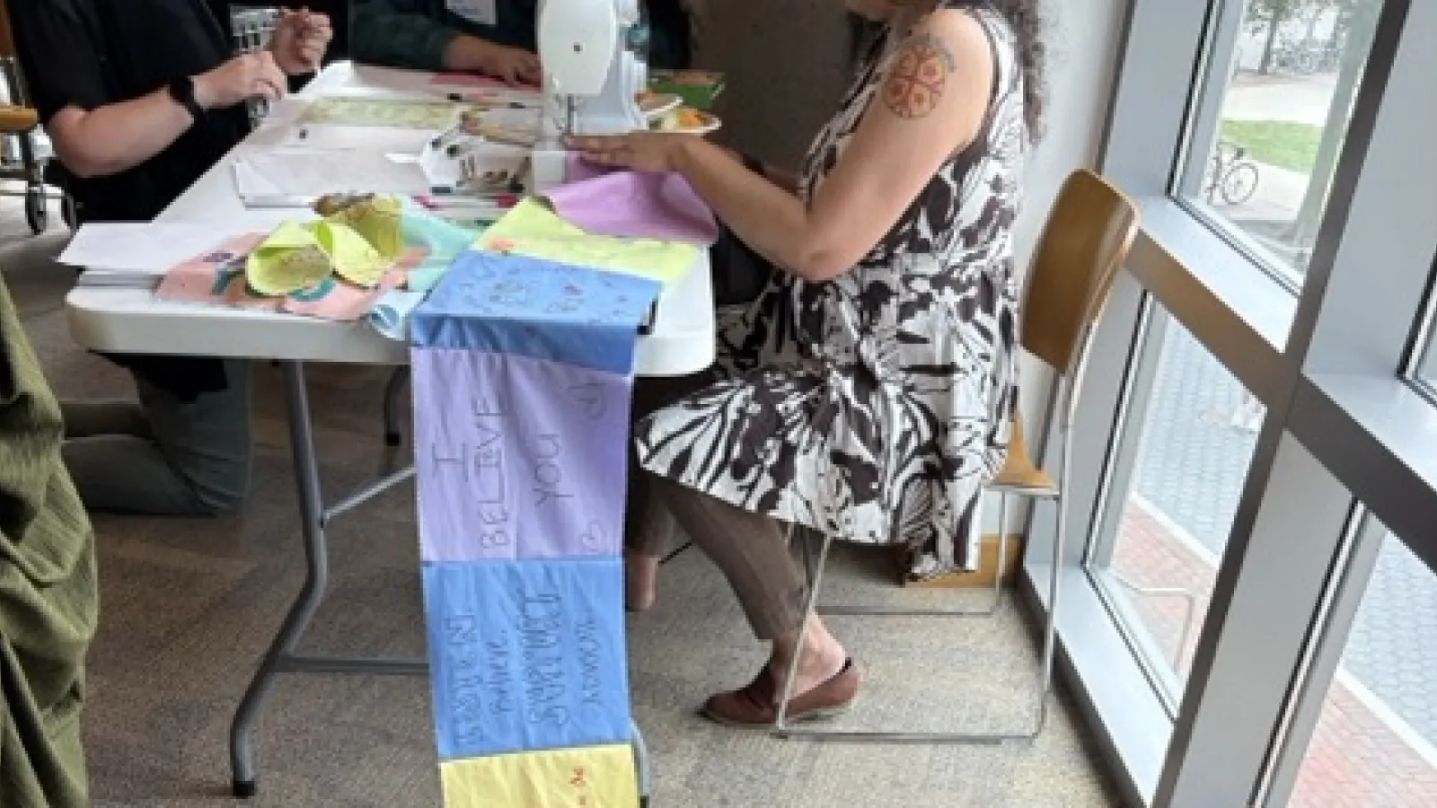 Woman sewing banner
