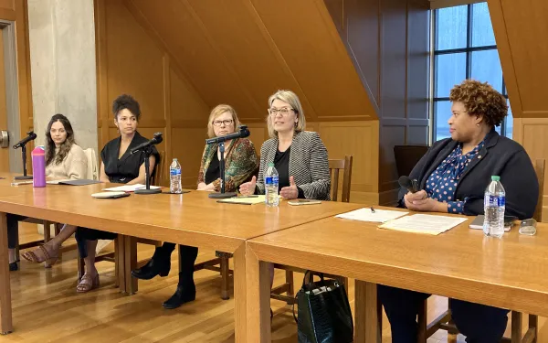 Photo of speakers at table