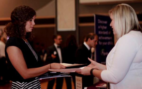 Student talking to employer at career fair