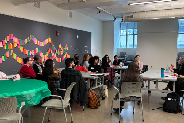 students sitting at tables listening to workshop