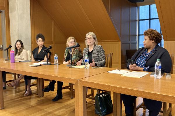Photo of speakers at table
