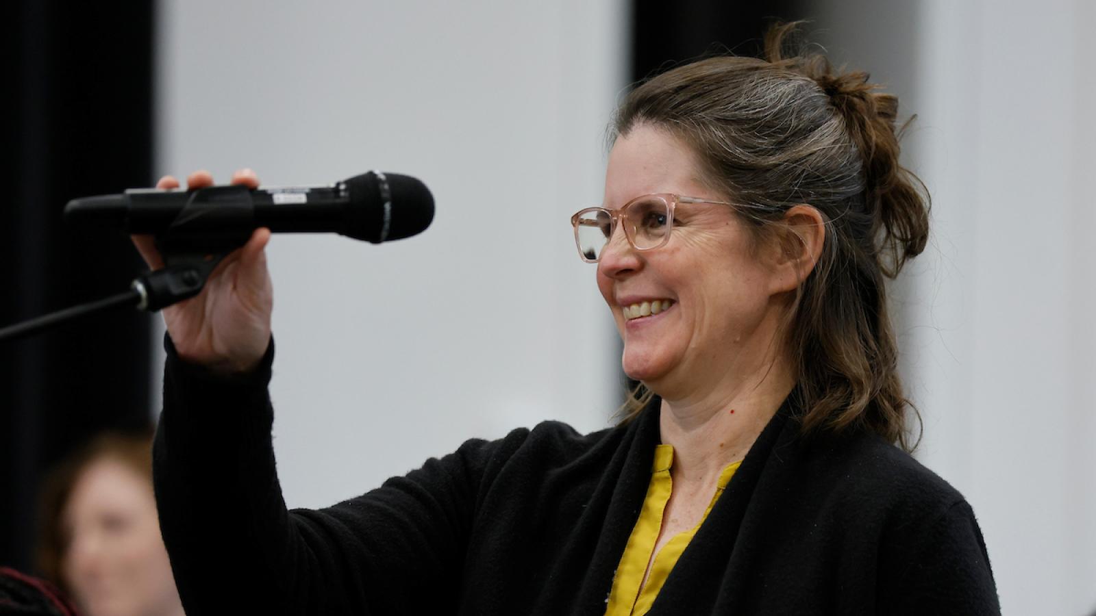 Alison Norris holding microphone