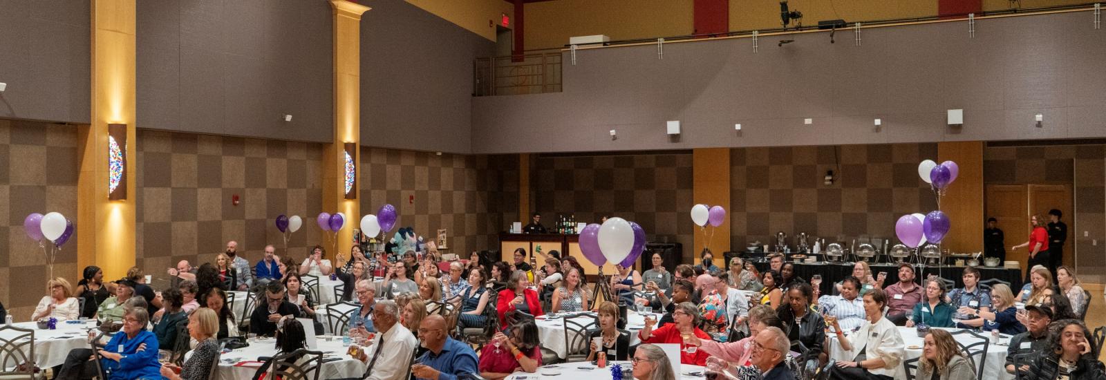 Guests sitting at tables at Ohio Union during WGSS 50th anniversary dinner reception